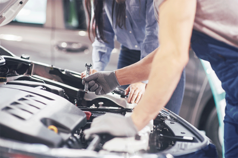 Mechanic Under Car Hood